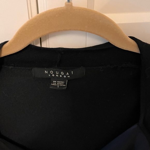 Light weight sweater with satin ribbon over chest, low cut and form fitting. - Picture 2 of 5